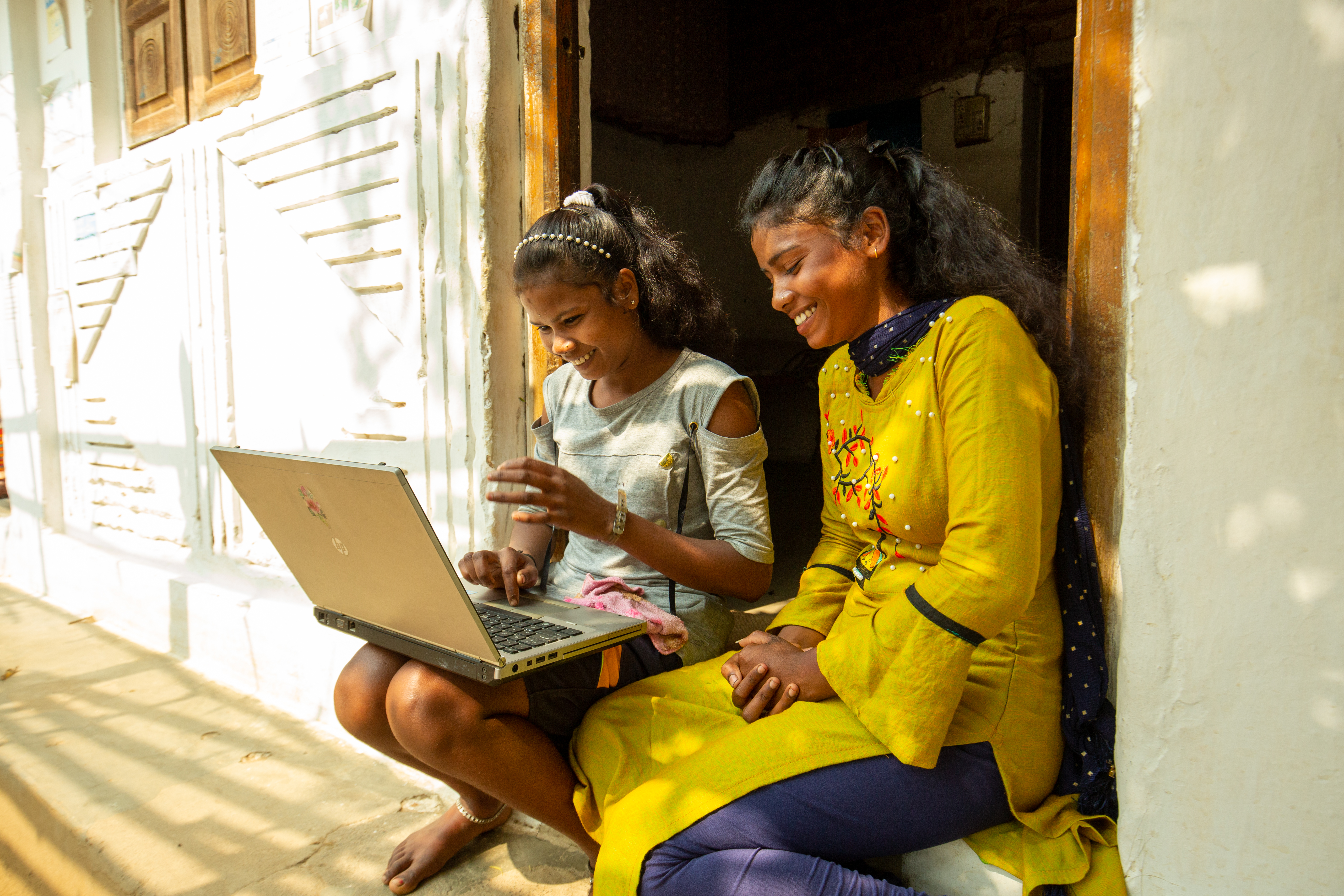 Students studying at home using BharatNet broadband